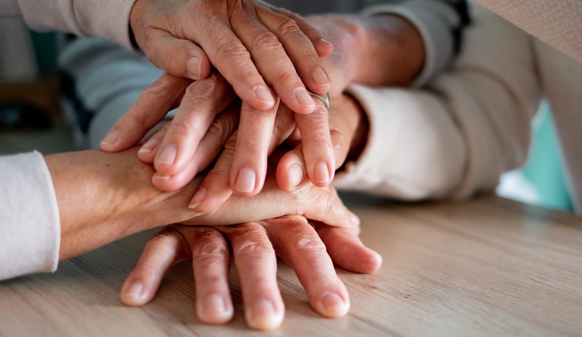 group-of-old-hands-on-top-of-each-other-express